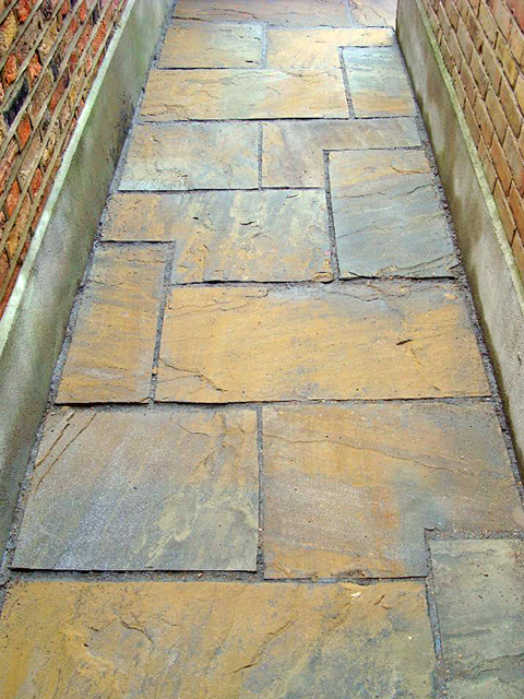A pavement made from riven yorkstone paving flags